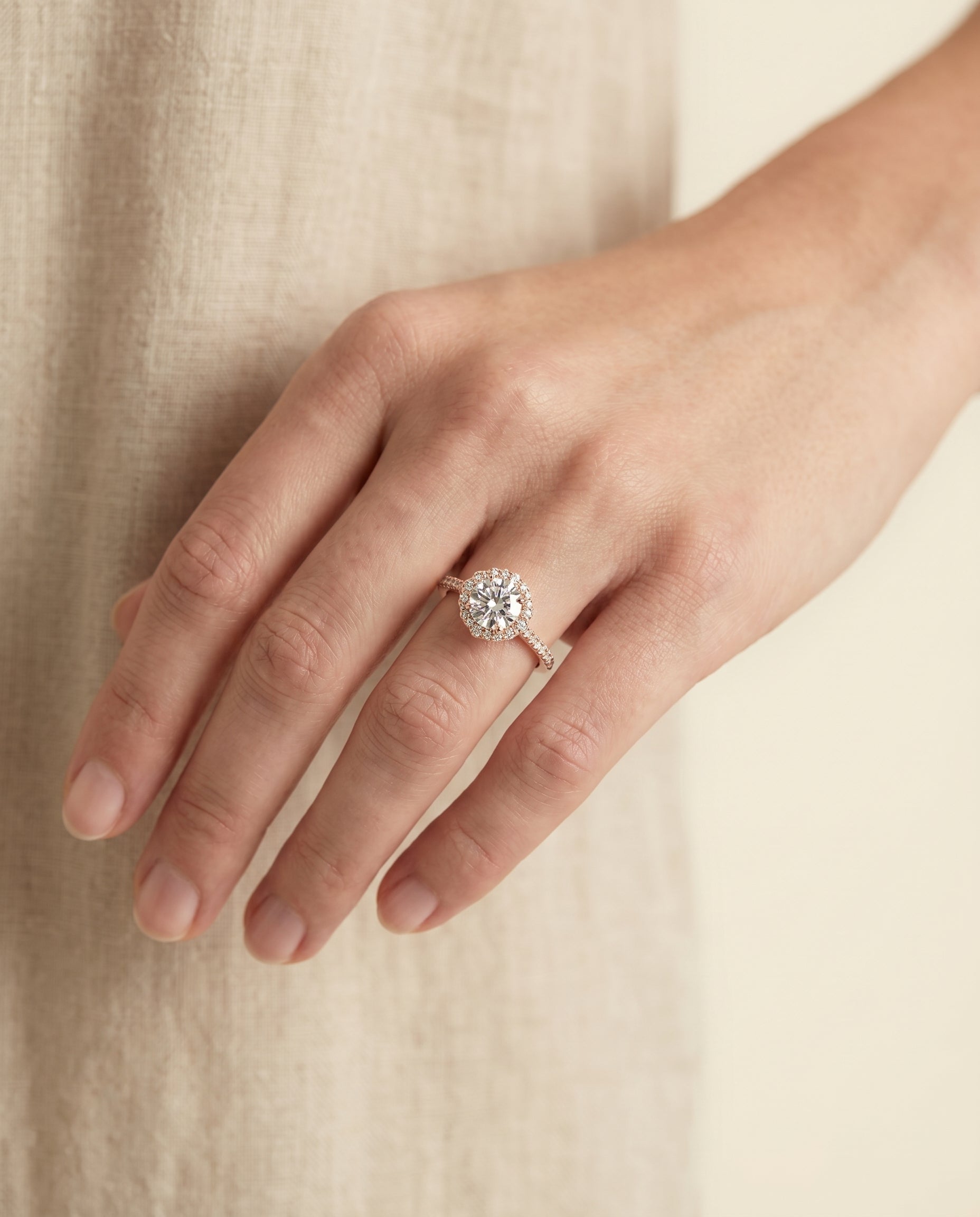 Florence Select Vintage Scalloped Halo Round Lab Diamond Engagement Ring in 14K Rose Gold, shown on hand, angled | RockHer