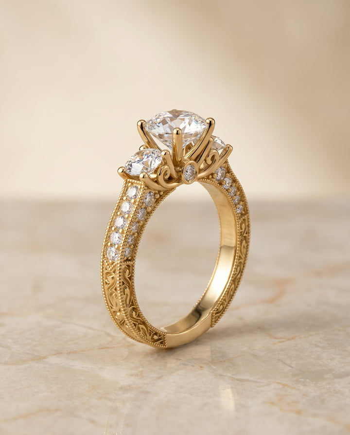 Round Brilliant, Vintage Scroll Three Stone, in 18K Yellow Gold, pave setting – angled view | RockHer