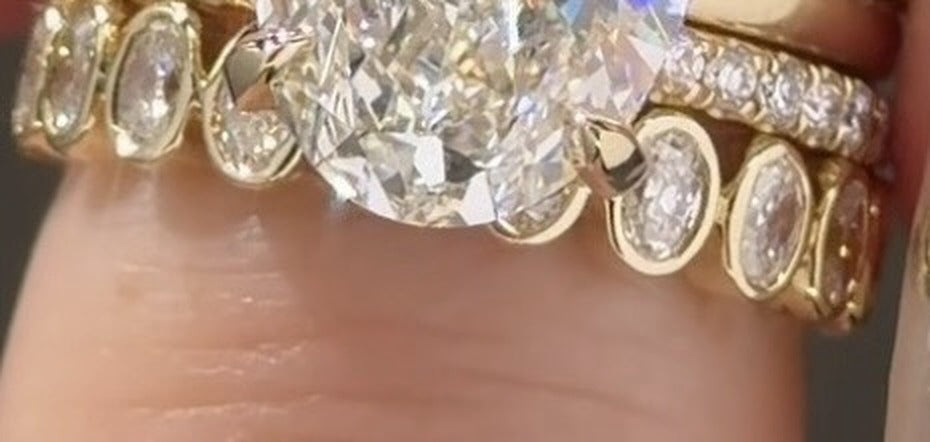 The two bands, bezel east west oval and thin pavé, as she chose them