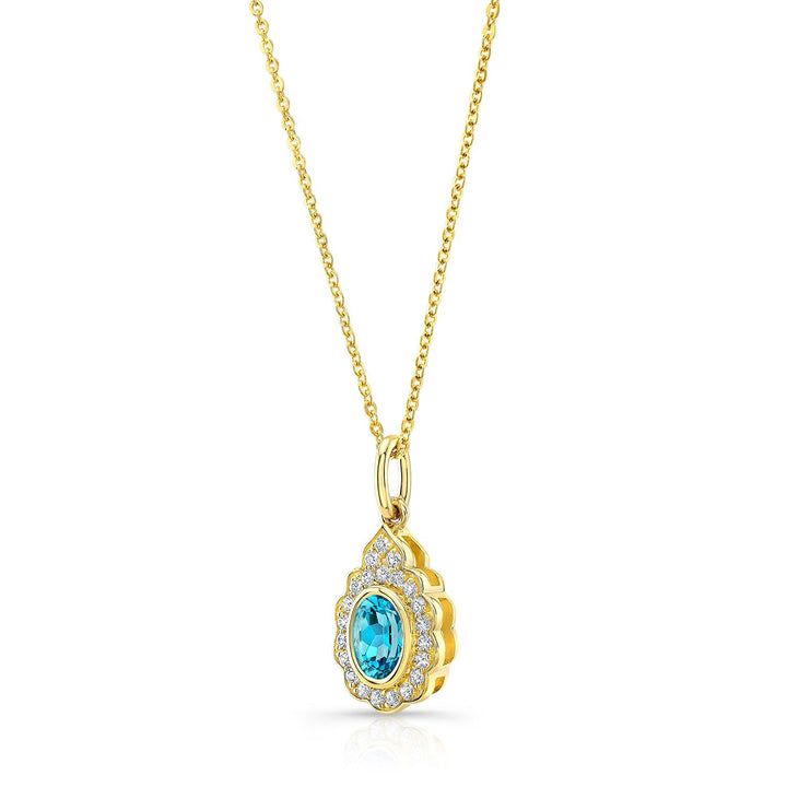 Blue Topaz And Diamond Oval Bezel Pendant With Teardrop Scallop Frame In 14k Yellow Gold (7x5mm) Adj Chain