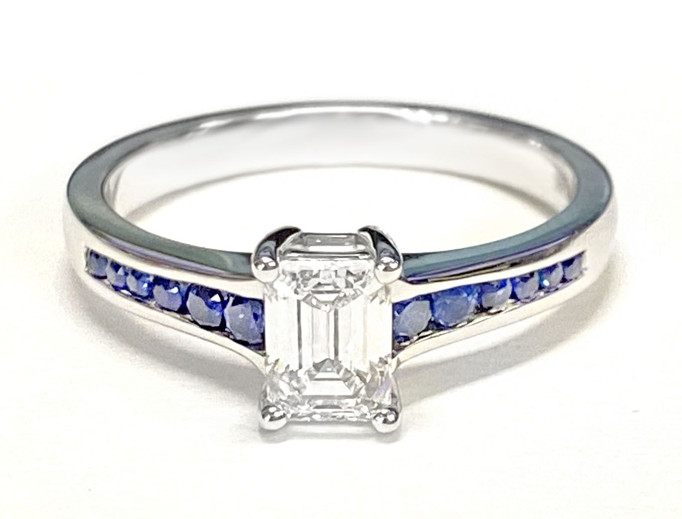 18K White Gold Emerald Cut Contemporary Tapered Blue Sapphire Channel Engagement Ring