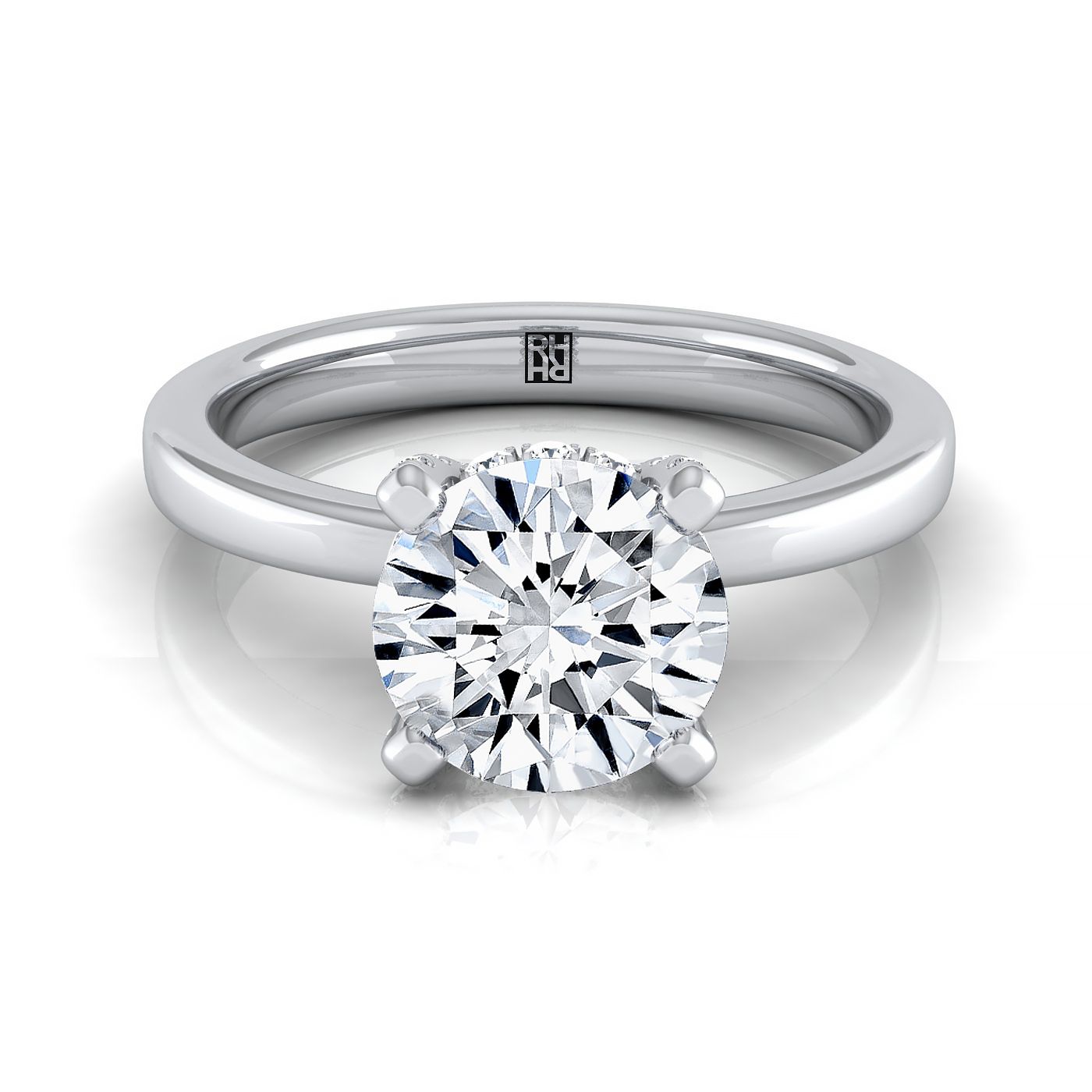 Platinum Round Brilliant Diamond Adorned Claws and Secret Halo Solitaire Engagement Ring -1/10ctw