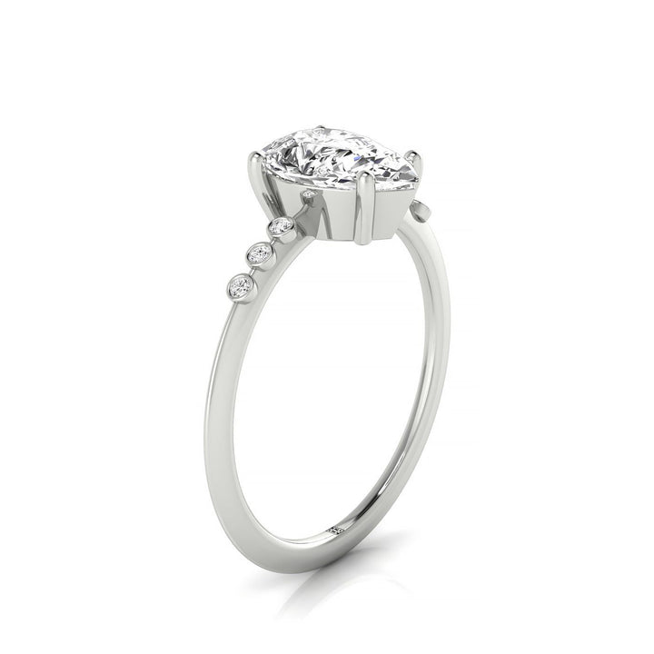 18kw Pear Engagement Ring With 6 Bezel Set Round Diamonds On Shank