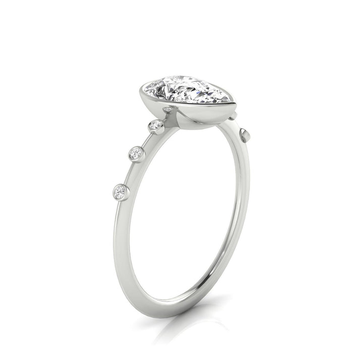 14kw Bezel Set Pear Engagement Ring With 6 Bezel Set Round Diamonds On Shank