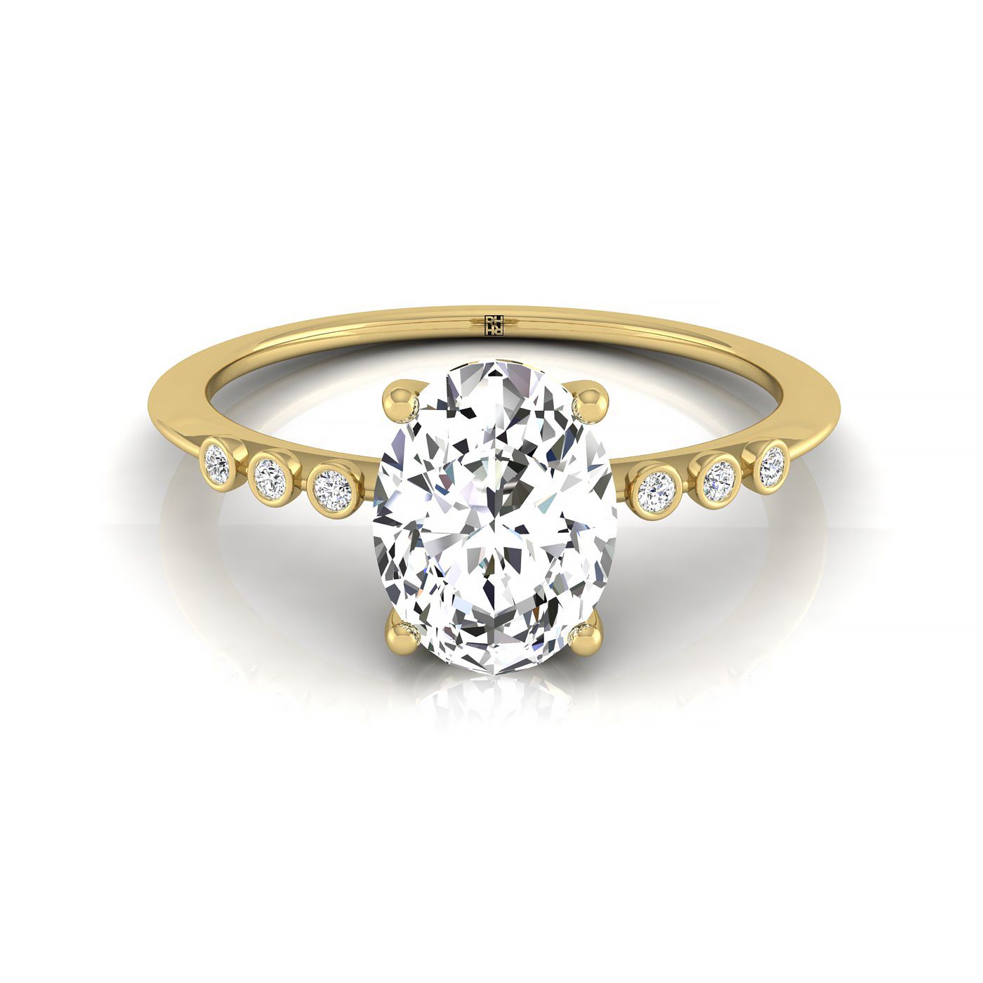 The Peggy oval setting in 18K Yellow Gold, a bezel accent solitaire design from RockHer