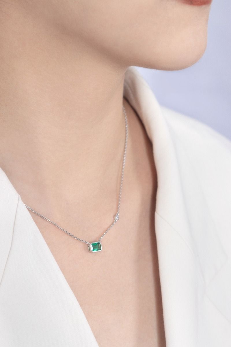 ROCKHER.925 Sterling Silver Emerald Cut Created Green Emerald and Round Cut White Cubic Zirconia Bezel Set Pendant Necklac...
