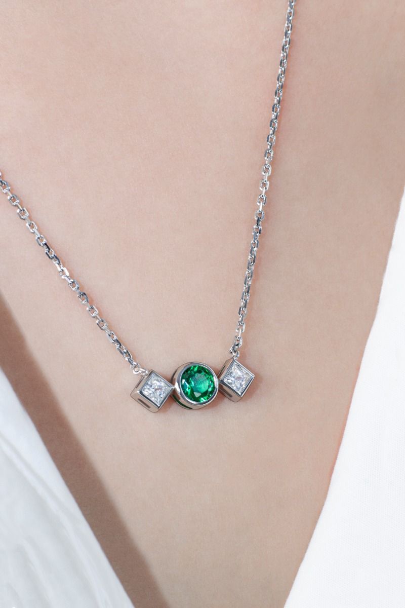 ROCKHER .925 Sterling Silver Round Created Emerald and Princess Cut White Cubic Zirconia Bezel Set Pendant Necklace on 18"...