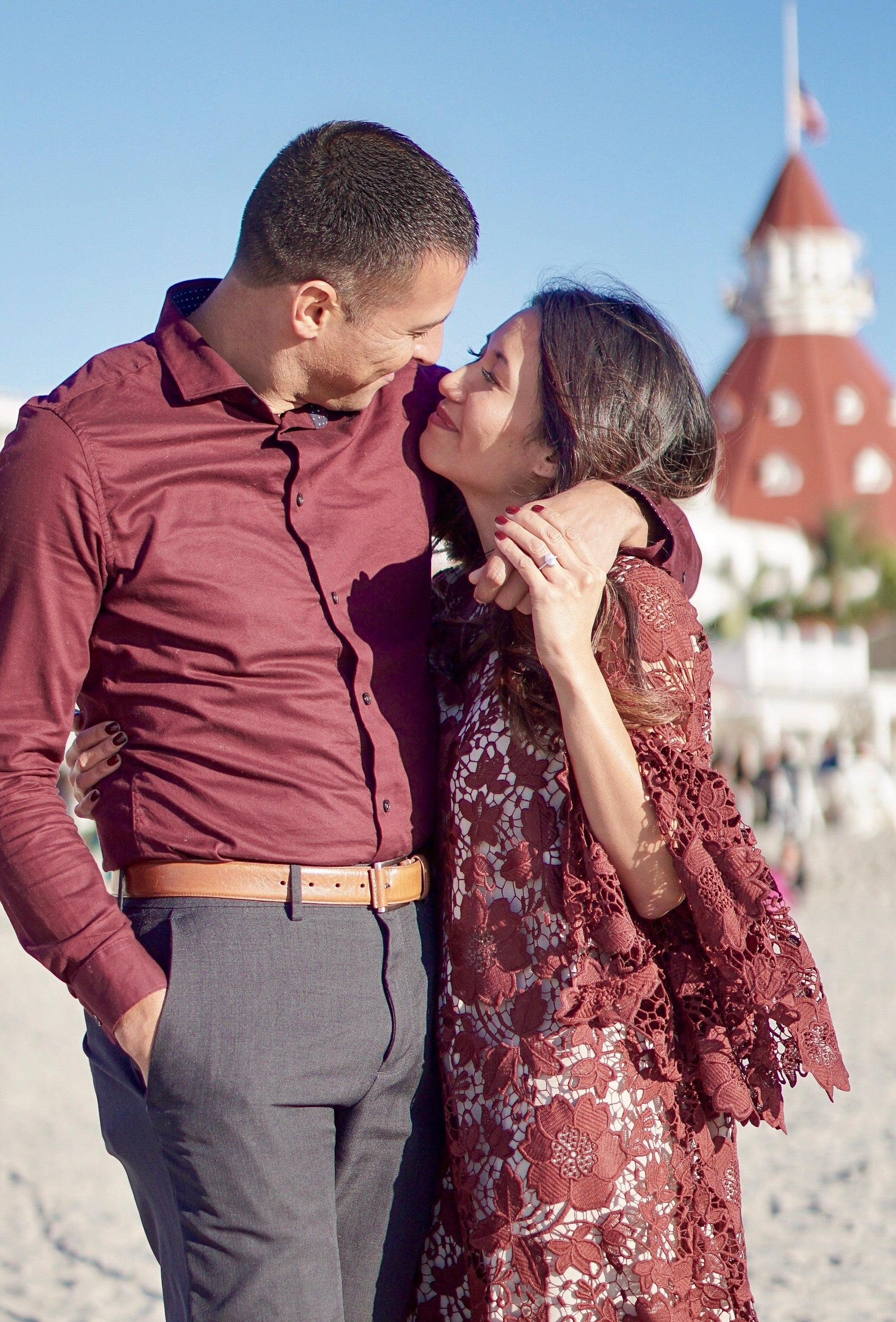 Couple looking at engagement ring designs together